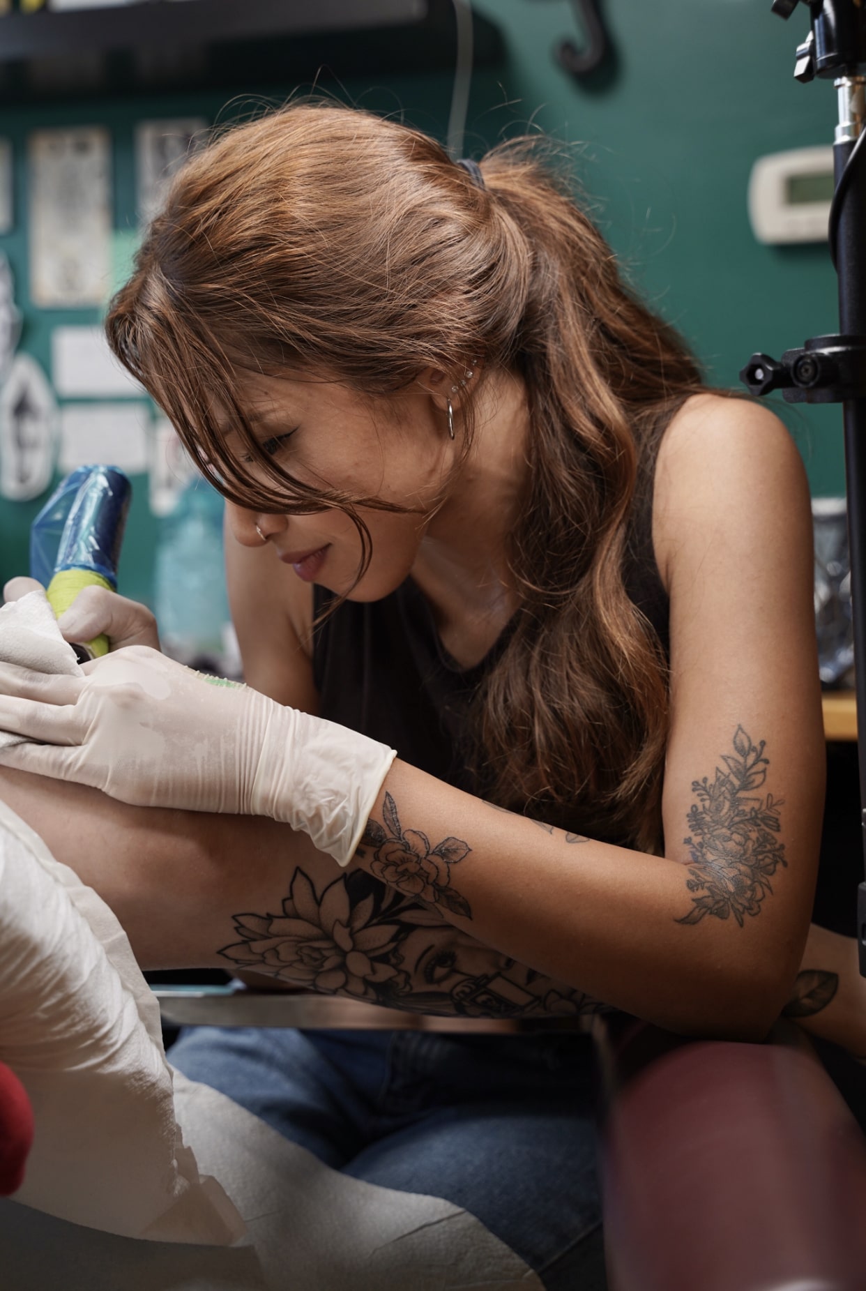 Fine line iris flower tattoo on the rib